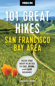 Book cover featuring image of orange poppies on green hills with text 101 Great Hikes San Francisco Bay Area